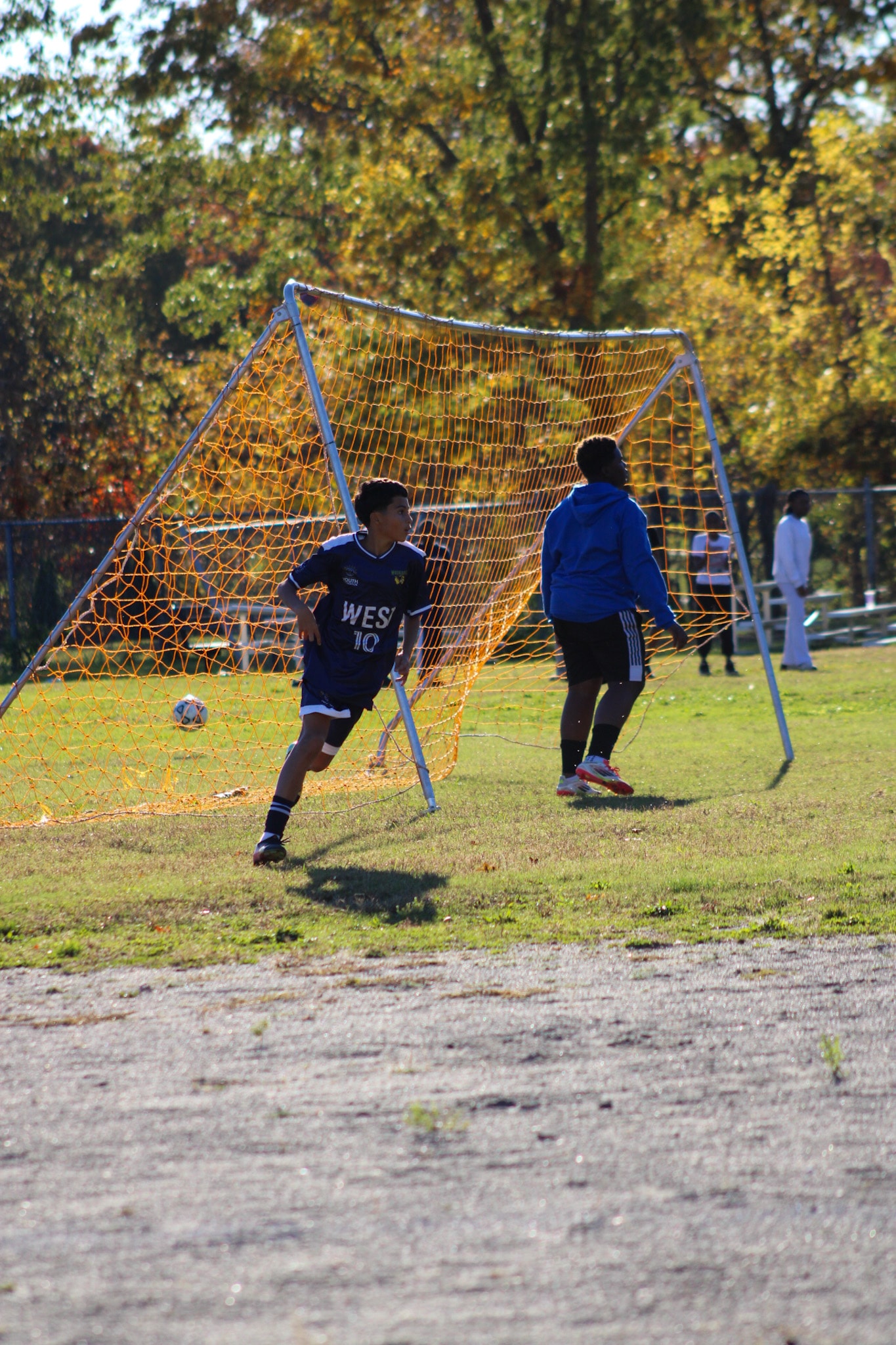 Youth soccer player in WEST jersey on the field